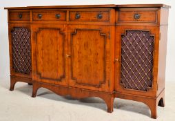 A Regency style yew wood breakfront pier cabinet -