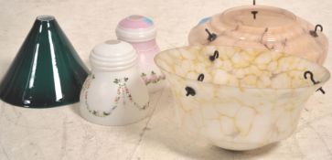 Two art deco glass ceiling lamp shades with hanging chains along with 3 other later glass shades one