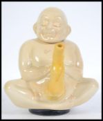A retro Tupperware  1984 Tim Mitchinson ceramic teapot in the form of a seated Buddha teapot the lid
