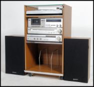 A vintage / retro 1970's stacking system by Hitachi to include amp, tuner, cassette player, record