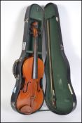 Musical Instruments. A 20th century cased violin by Skylark - complete in the original carry