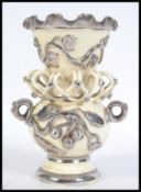 A 19th century lustered embellished vase having vi
