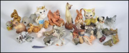 A collection of vintage wade figures and similar together with some SylvaC ceramic animal figures