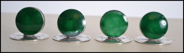 A set of four silver and enamel hallmarked place s