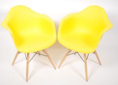 A set of 2 contemporary Eames style DAR dining cha
