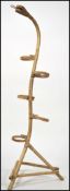 A rare mid century whicker ' snake ' plant stand.