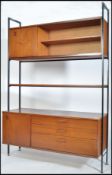 A 1970's retro teak wood and modular metal upright
