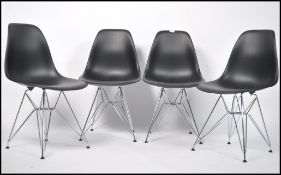 A set of 4 contemporary Eames style DSW dining cha