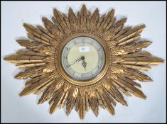 A 1940's original Sunburst wall clock by Smiths of