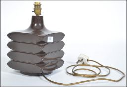 A mid century modernist design table lamp in a ric