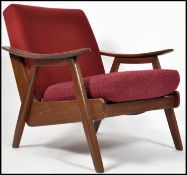 A 1970's Danish teak wood armchair having fabulous