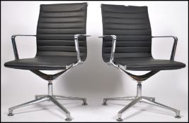 A pair of retro style Eames chrome and faux black