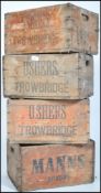 A stack of   vintage mid century wooden advertisin