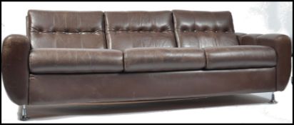 An original 1970's Danish leather sofa raised on c