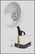 A retro 1950's Hanovia heat lamp in cream with ori