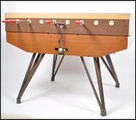 A 1970's coin operated large table football foosba