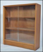 A 1960's Herbert Gibbs teak wood sliding glass lib