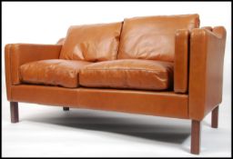 A stunning 1970's style brown leather two seater s