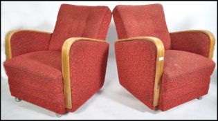 A pair of 1930's Art Deco club armchairs having re