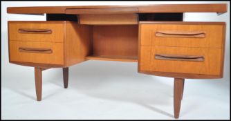 A 1970's G-Plan teak wood writing table desk  in t