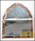 A 1930's peach glass Venetian wall mirror of arche