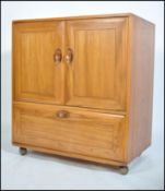 An Ercol 20th century light elm wood ' Windsor ' p