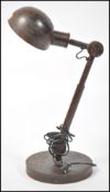 A 20th century anglepose desk lamp of rustic form