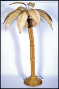 A large floor standing palm tree floor lamp. Turne