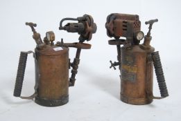A pair of oversized vintage paraffin blow lamps. E