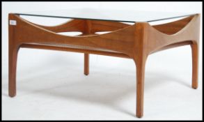 A 1960's Danish teak wood square coffee table rais