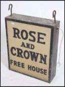 A large twin sided and illuminated retro mid centu