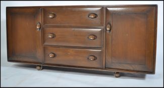 An Ercol 1970's large ' Windsor ' pattern elm wood