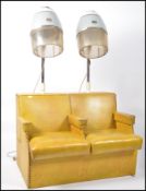 A retro  1950's mustard yellow vinyl salon sofa wi
