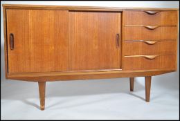 A 1970's retro Danish influence teak wood sideboar