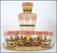 A 1930's Art Deco glass cocktail set comprising dr