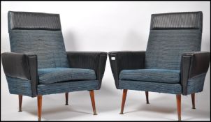 A pair of mid century retro two tone armchairs hav