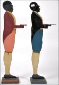 A pair of mid century painted wooden negro dumb wa