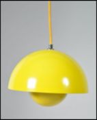 A contemporary flower pot pendant lamp in yellow b