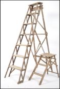 An early 20th century Industrial wooden ladder wit