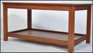 A 1970's teak and twin tile coffee table. The dark