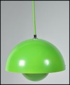 A contemporary flower pot pendant lamp in green by