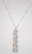 A hallmarked silver ingot pendant on a s