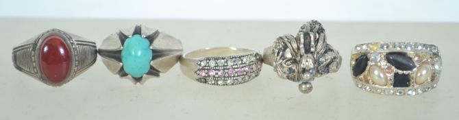 A group of 5 silver white metal dress ri