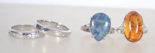 A group of 4 silver 925 dress rings to i