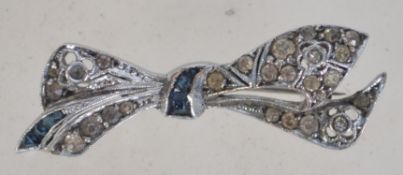 A silver and marcasite brooch in the for