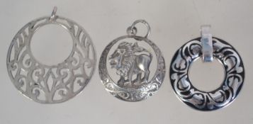 A collection of 3 silver necklace pendan