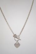 A silver bead / ball necklace and pendan