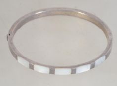 A silver and mother of pearl inlaid bang