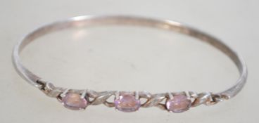 A silver 925 bangle bracelet set with th