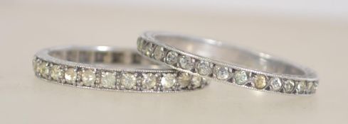 2 silver eternity rings, both being chan